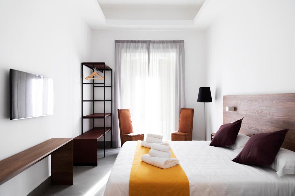 Un pat sau paturi într-o cameră la Acate81 Lifestyle Apartment
