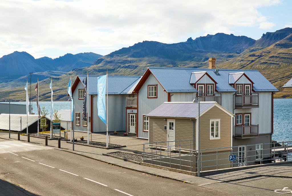 a row of houses on the side of a road at Fosshotel Eastfjords in Fáskrúðsfjörður