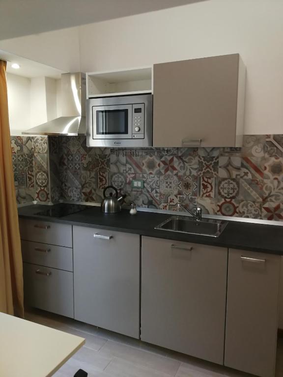 Kuchyň nebo kuchyňský kout v ubytování IG-Tysandros Hotel Apartments