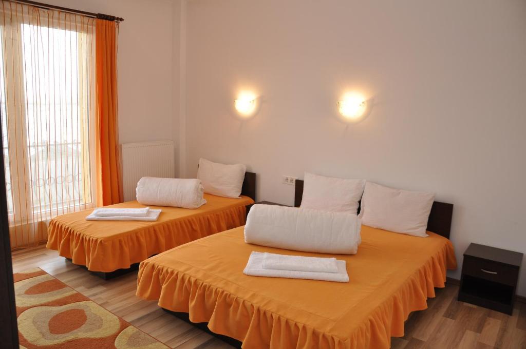 Letto o letti in una camera di Pensiunea Zbor
