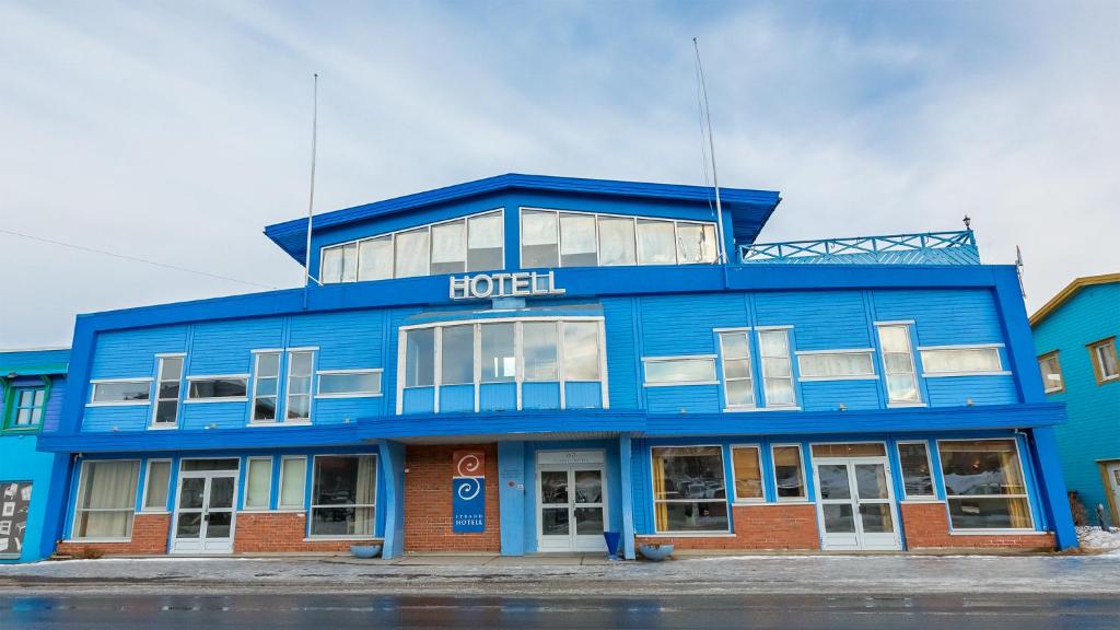 a blue building with the words hotel at Strand Hotell Sortland in Sortland