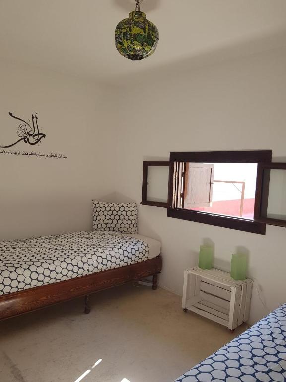 Voodi või voodid majutusasutuse Riad El Maâti toas