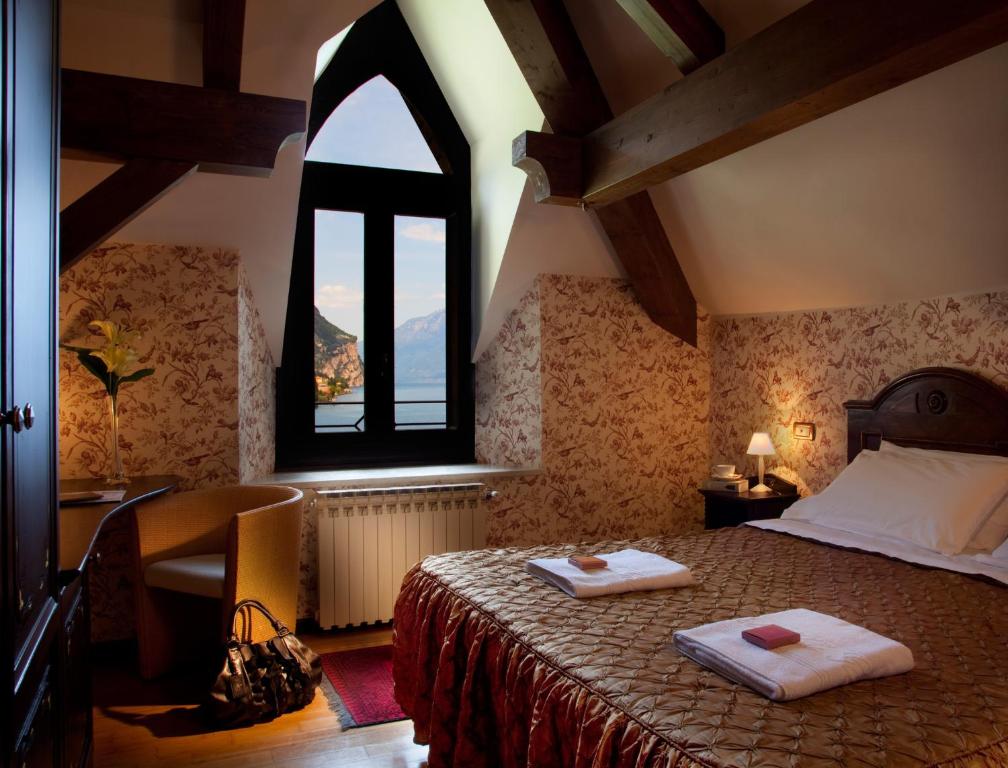 Postel nebo postele na pokoji v ubytování Hotel Villa Giulia