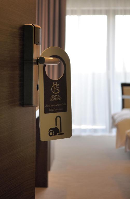 Postel nebo postele na pokoji v ubytování Hotel Scapino