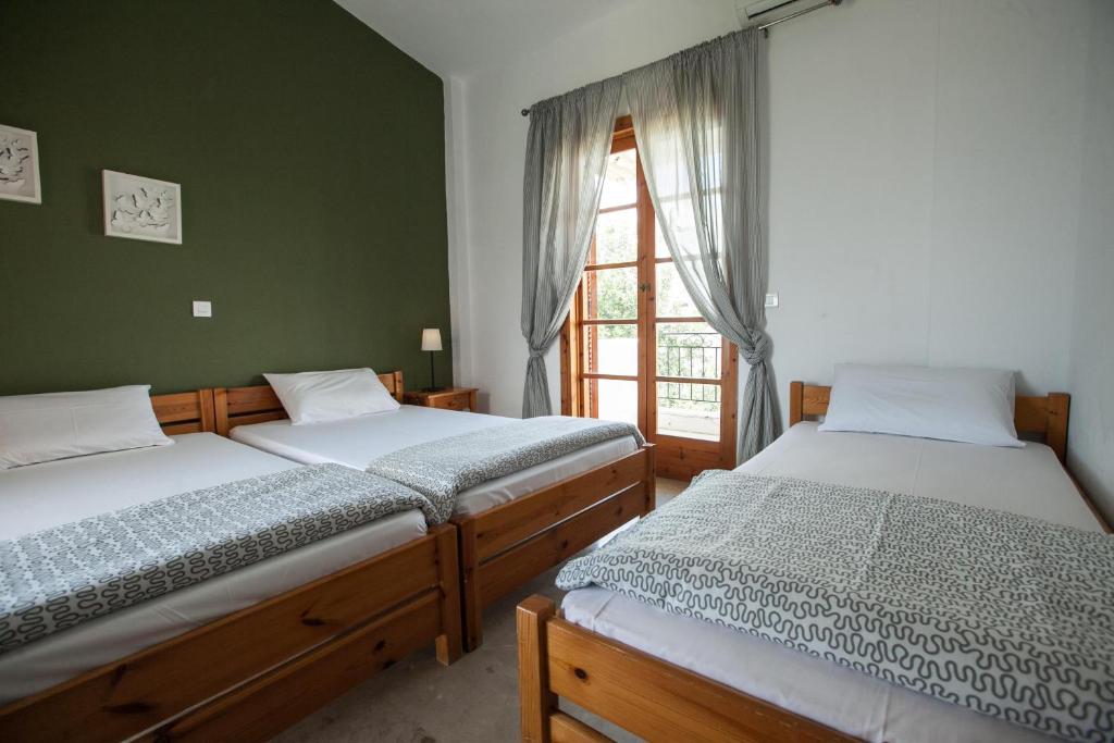 Postel nebo postele na pokoji v ubytování Sofia Apartments - Kantia