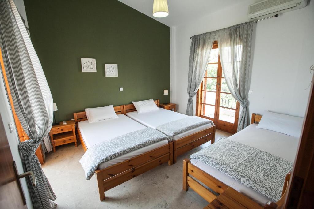 Postel nebo postele na pokoji v ubytování Sofia Apartments - Kantia