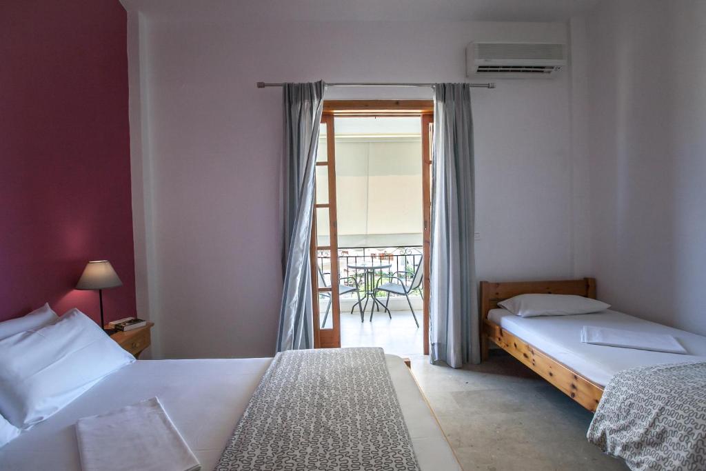 Postel nebo postele na pokoji v ubytování Sofia Apartments - Kantia