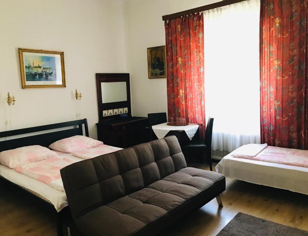 Posteľ alebo postele v izbe v ubytovaní Kis Gellért Guesthouse