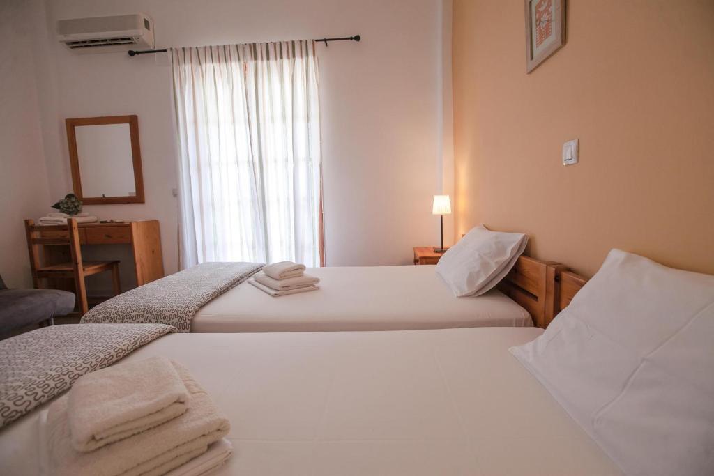 Postel nebo postele na pokoji v ubytování Sofia Apartments - Kantia