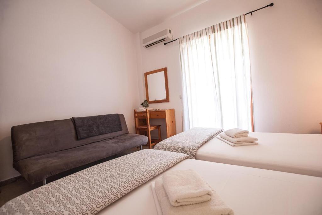Postel nebo postele na pokoji v ubytování Sofia Apartments - Kantia
