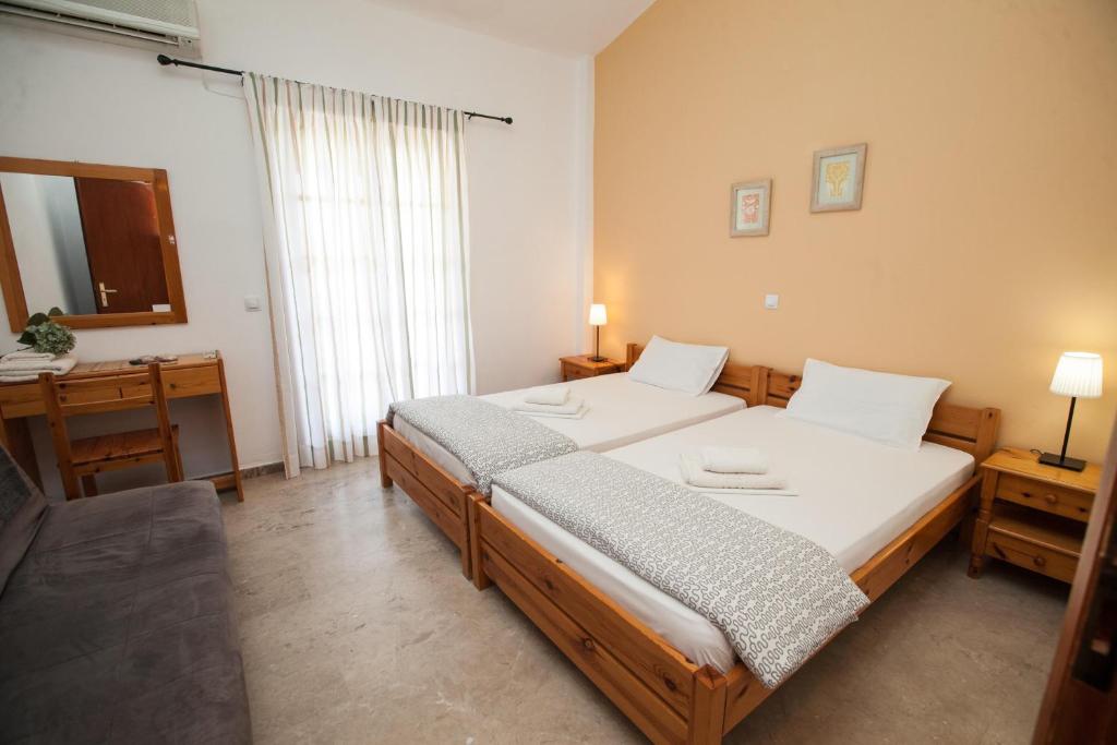 Postel nebo postele na pokoji v ubytování Sofia Apartments - Kantia