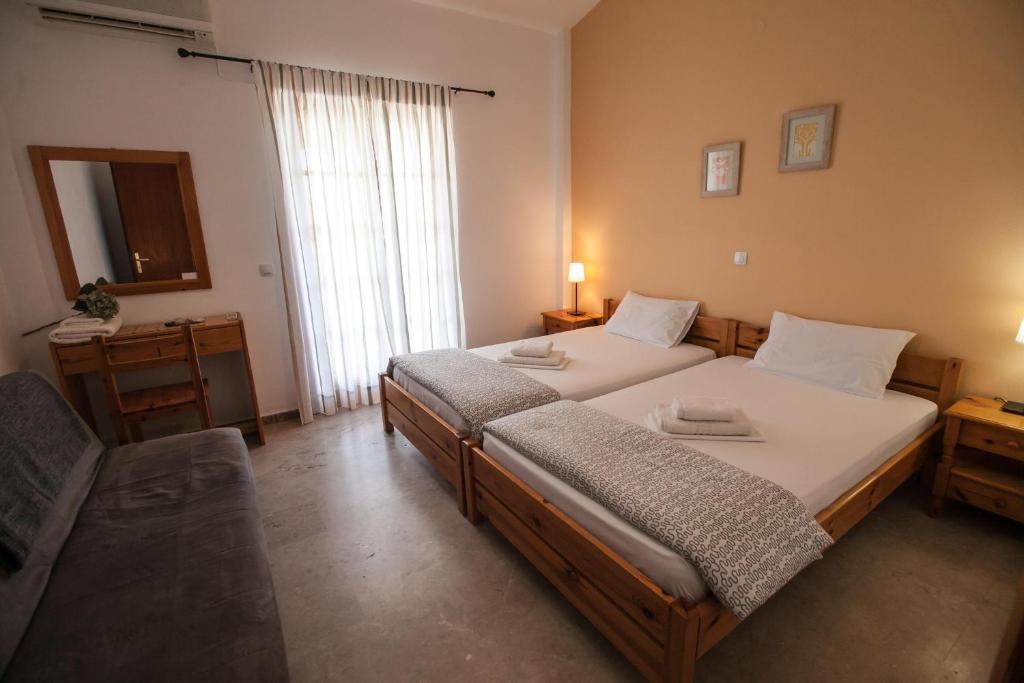 Postel nebo postele na pokoji v ubytování Sofia Apartments - Kantia