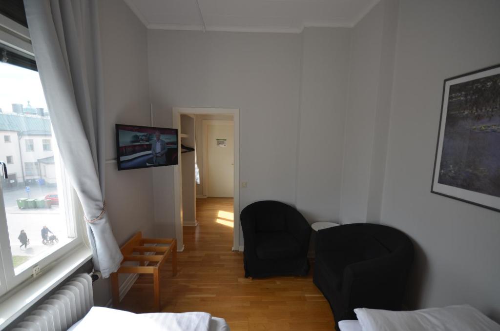 TV a/nebo společenská místnost v ubytování Hotell Royal
