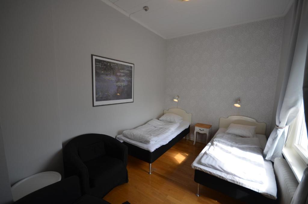 Postel nebo postele na pokoji v ubytování Hotell Royal