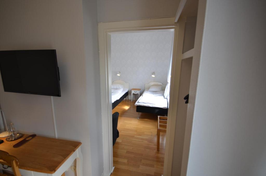 TV a/nebo společenská místnost v ubytování Hotell Royal