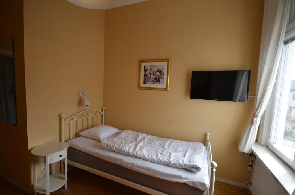 Postel nebo postele na pokoji v ubytování Hotell Royal