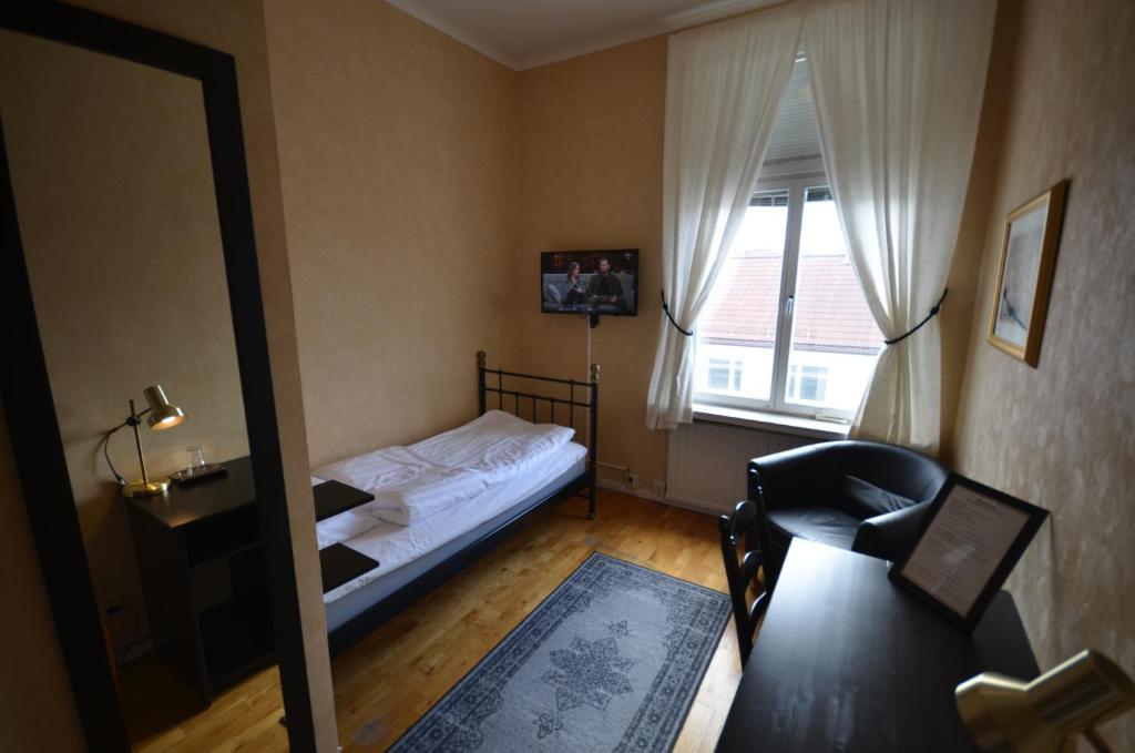 Postel nebo postele na pokoji v ubytování Hotell Royal