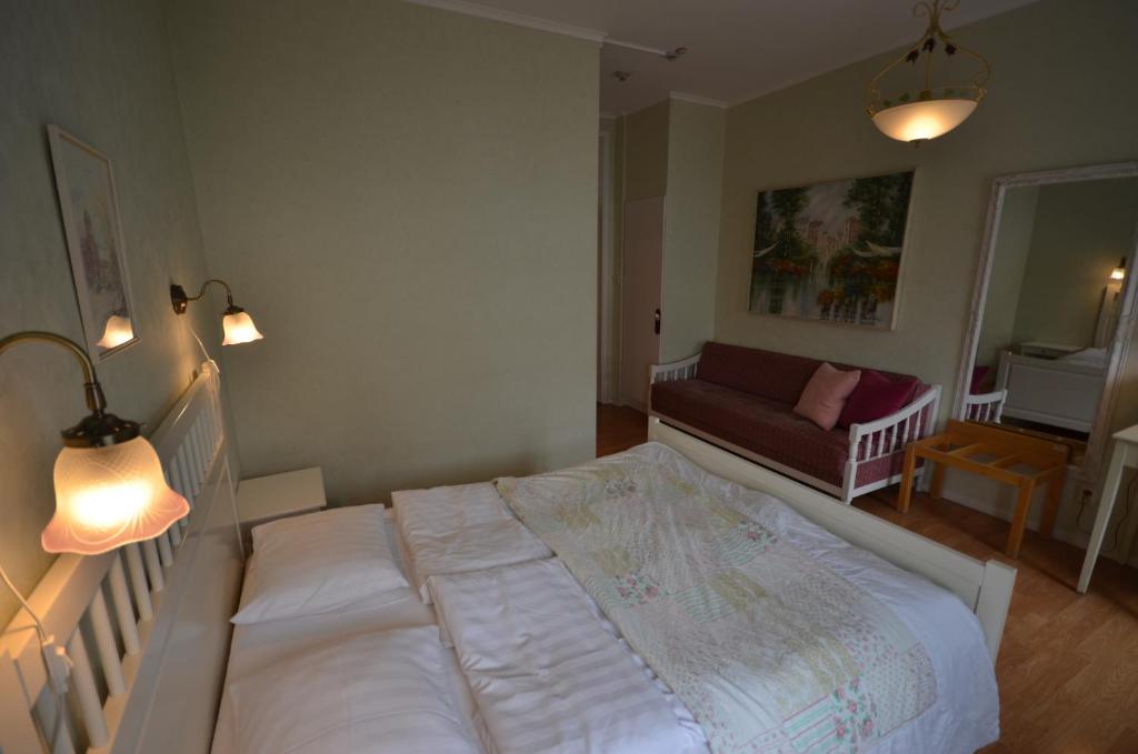 Postel nebo postele na pokoji v ubytování Hotell Royal