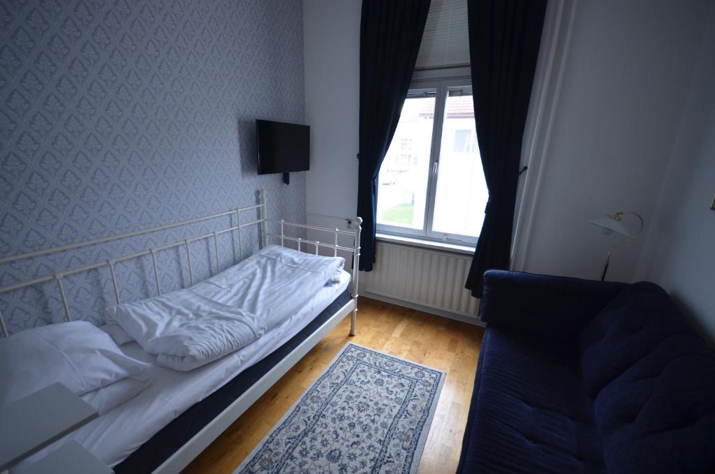 Postel nebo postele na pokoji v ubytování Hotell Royal