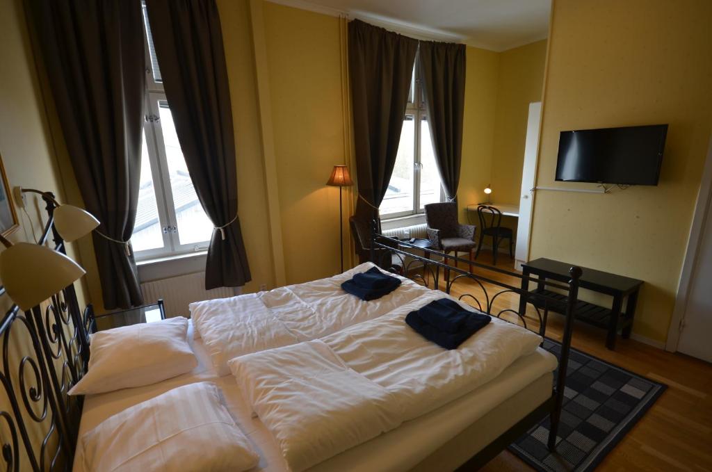 Postel nebo postele na pokoji v ubytování Hotell Royal