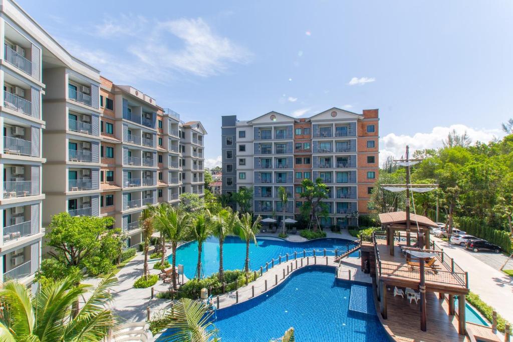 an aerial view of an apartment complex with a swimming pool at The Title Residencies Naiyang by Beringela in Nai Yang Beach