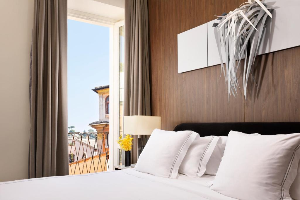Postel nebo postele na pokoji v ubytování The First Dolce - Preferred Hotels & Resorts