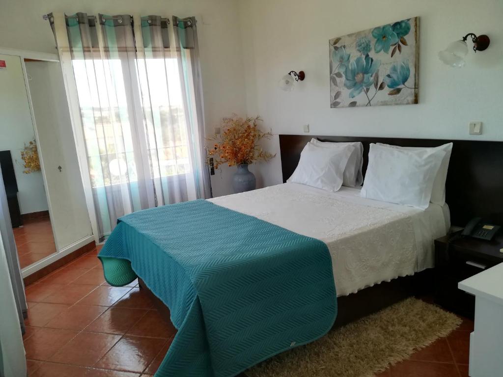 Cama ou camas em um quarto em Graca Hotel