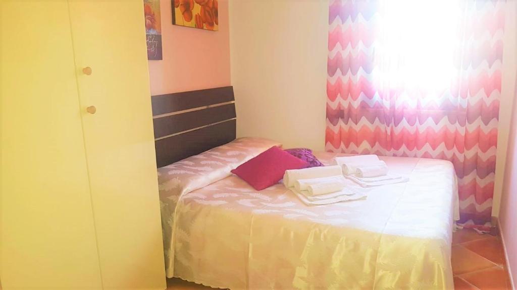 Łóżko lub łóżka w pokoju w obiekcie Villa Eden con piscina a Scopello