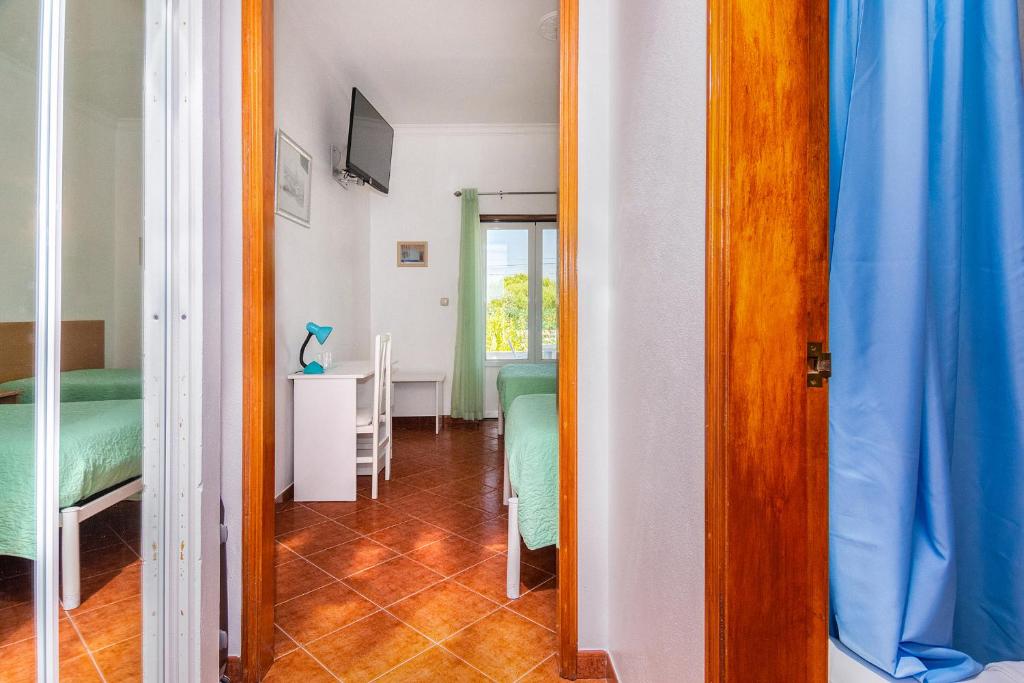 Cama ou camas em um quarto em Graca Hotel