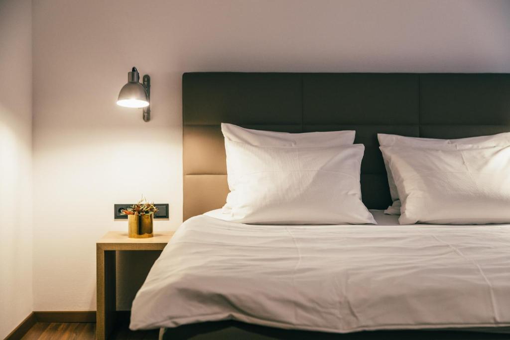 Postel nebo postele na pokoji v ubytování Boutique-Hotel Bayerischer Hof