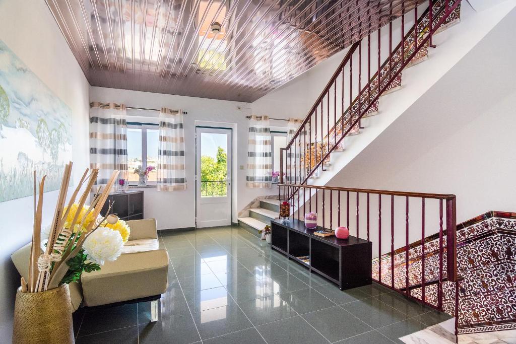 Uma área de estar em Graca Hotel