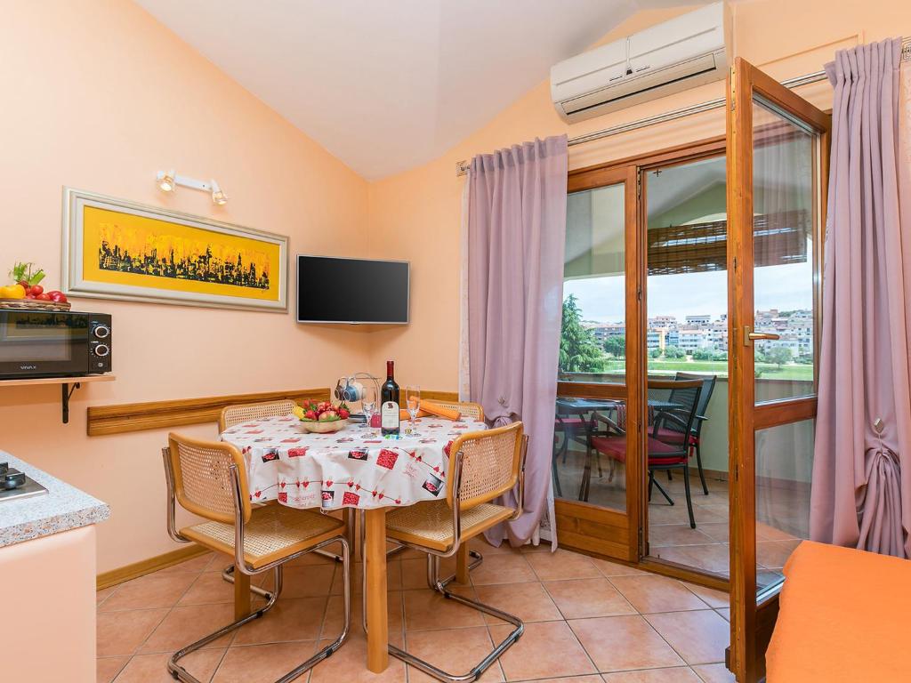 TV a/nebo společenská místnost v ubytování Apartments Nada