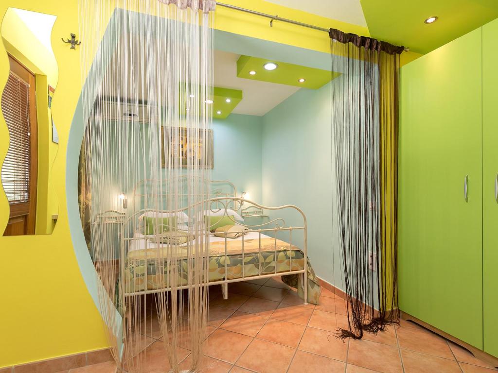 Postel nebo postele na pokoji v ubytování Apartments Nada