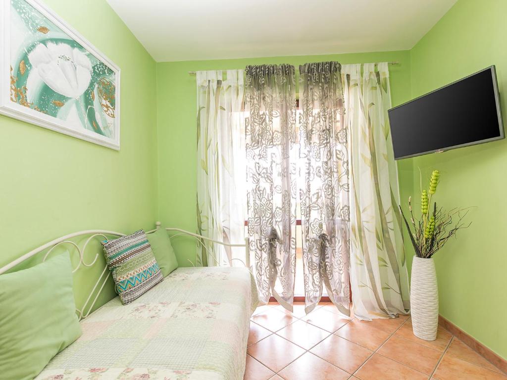 TV a/nebo společenská místnost v ubytování Apartments Nada