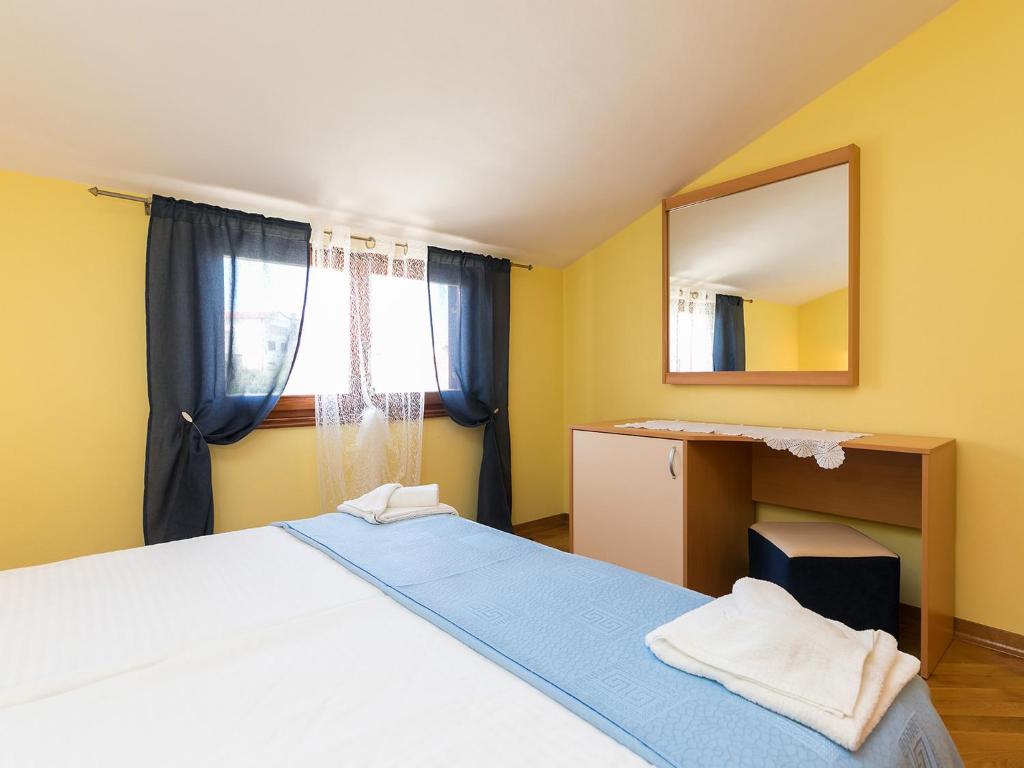 Postel nebo postele na pokoji v ubytování Apartments Nada