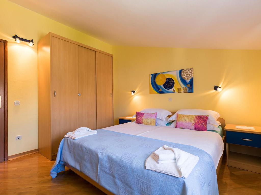 Postel nebo postele na pokoji v ubytování Apartments Nada