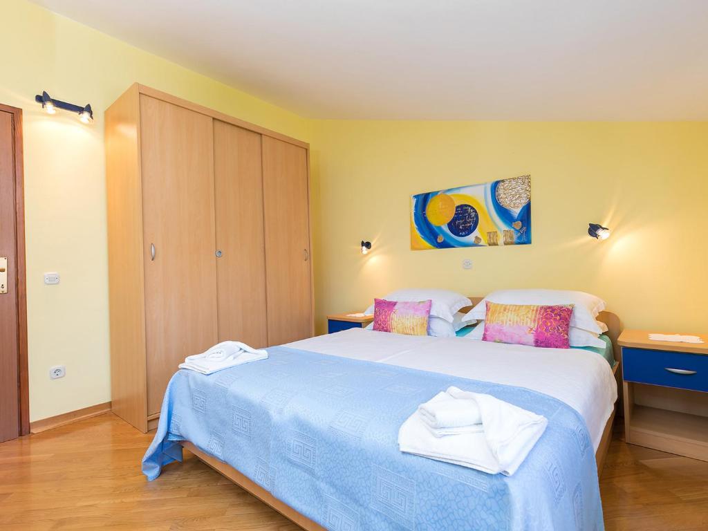 Postel nebo postele na pokoji v ubytování Apartments Nada