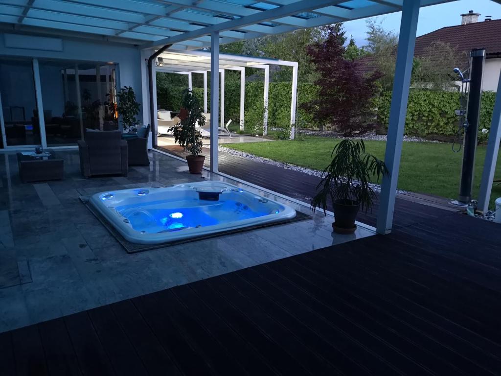 a jacuzzi tub on the patio of a house at Homestay Free Park&Bikes in Ljubljana