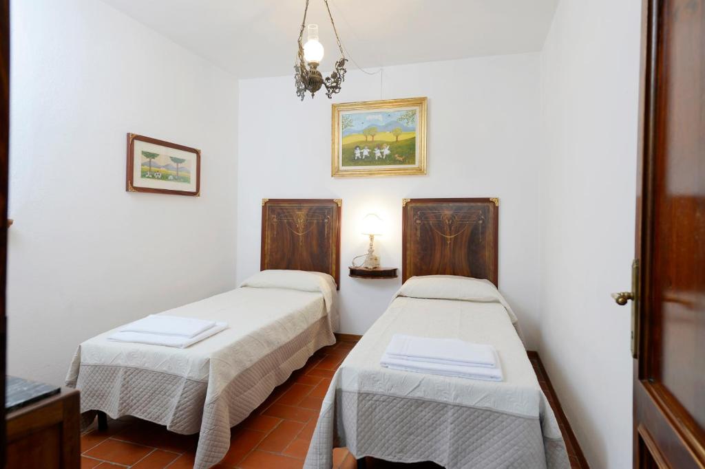 Postel nebo postele na pokoji v ubytování Casa Vacanze Podere Ugolini