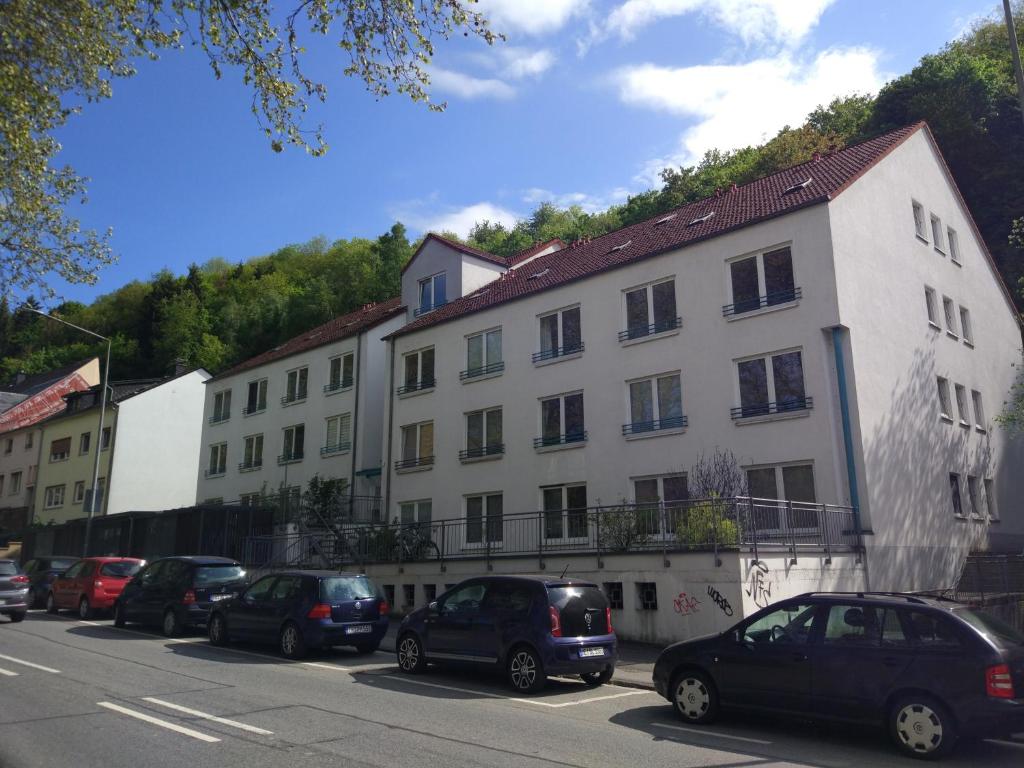 a group of cars parked in front of a building at Ferienappartement Trier in Trier
