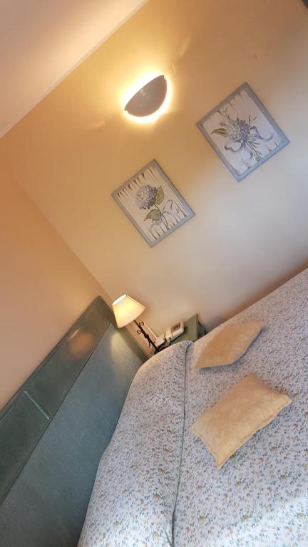 Postel nebo postele na pokoji v ubytování Hotel Gallo Nero