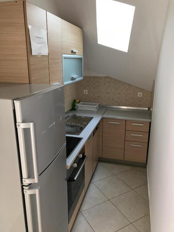 Kuchyň nebo kuchyňský kout v ubytování Ari Apartments
