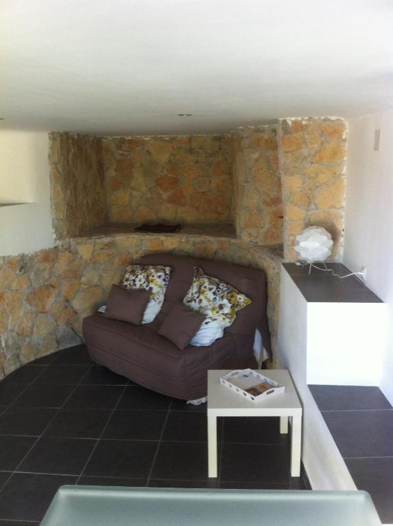 a living room with a couch and a table at Gîte Polema in Marseille