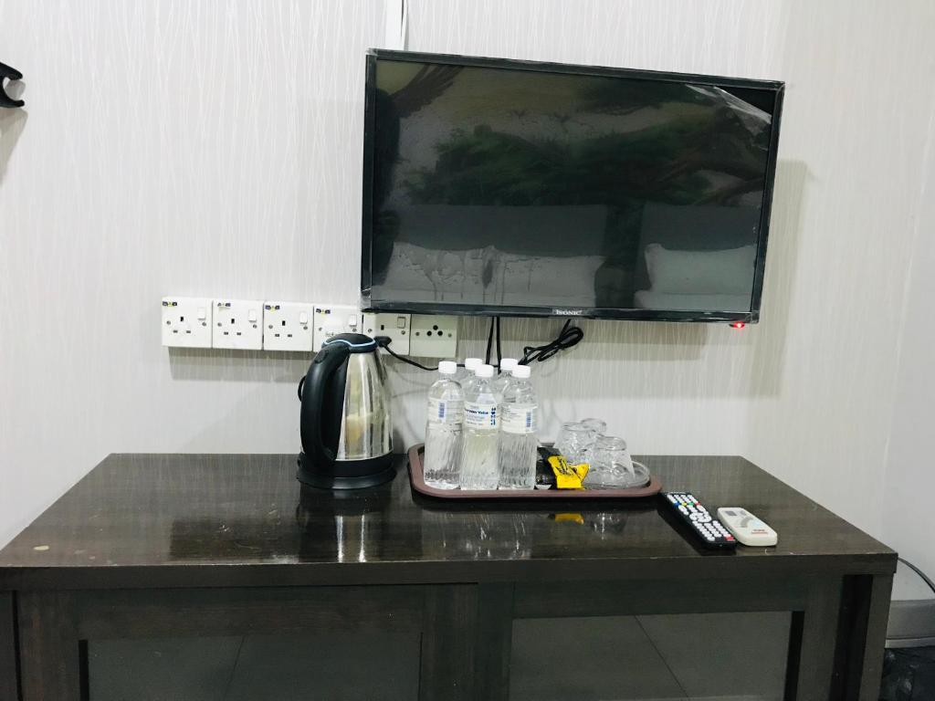 TV a/nebo společenská místnost v ubytování Home Inn Hotel
