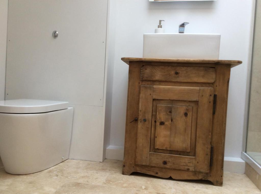 a bathroom with a sink and a toilet at Passengers House in Whitstable