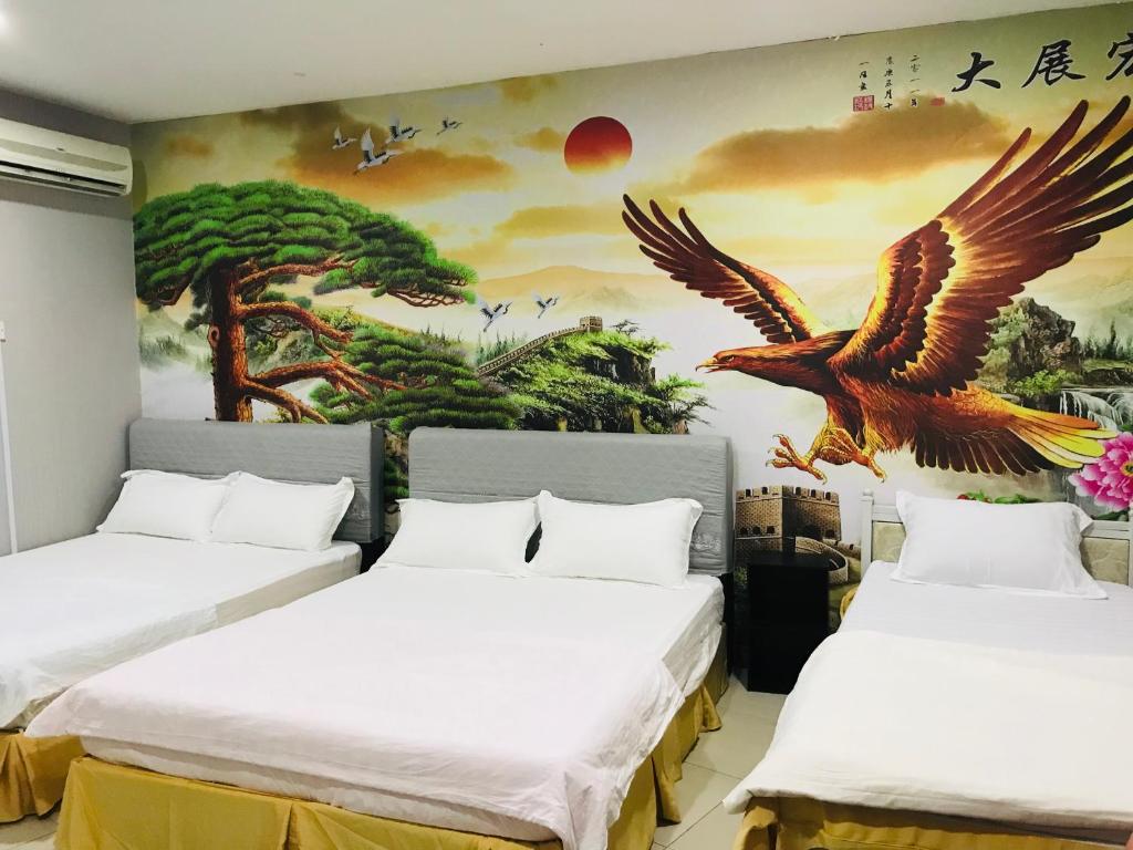 Postel nebo postele na pokoji v ubytování Home Inn Hotel