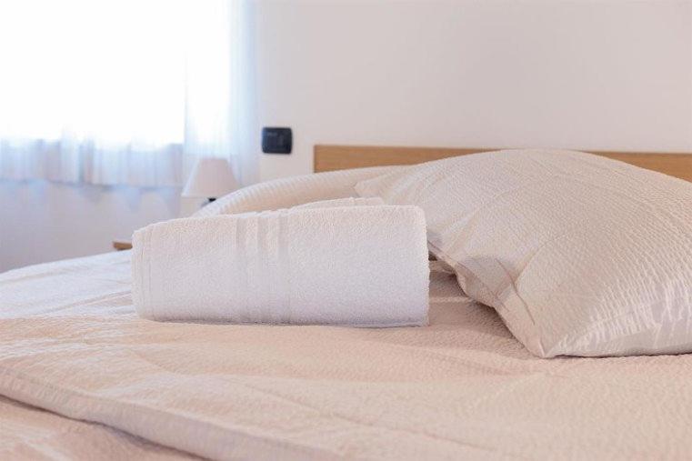 Postel nebo postele na pokoji v ubytování Hotel Milano