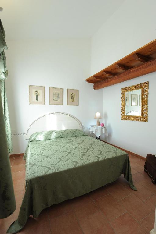 Postel nebo postele na pokoji v ubytování Casa Vacanze Podere Ugolini