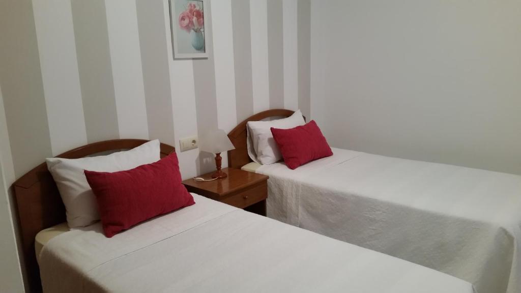 Posteľ alebo postele v izbe v ubytovaní Apartamentos Timón Puerto