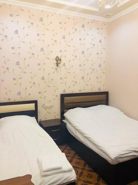 Postel nebo postele na pokoji v ubytování Har-Mar Hotel